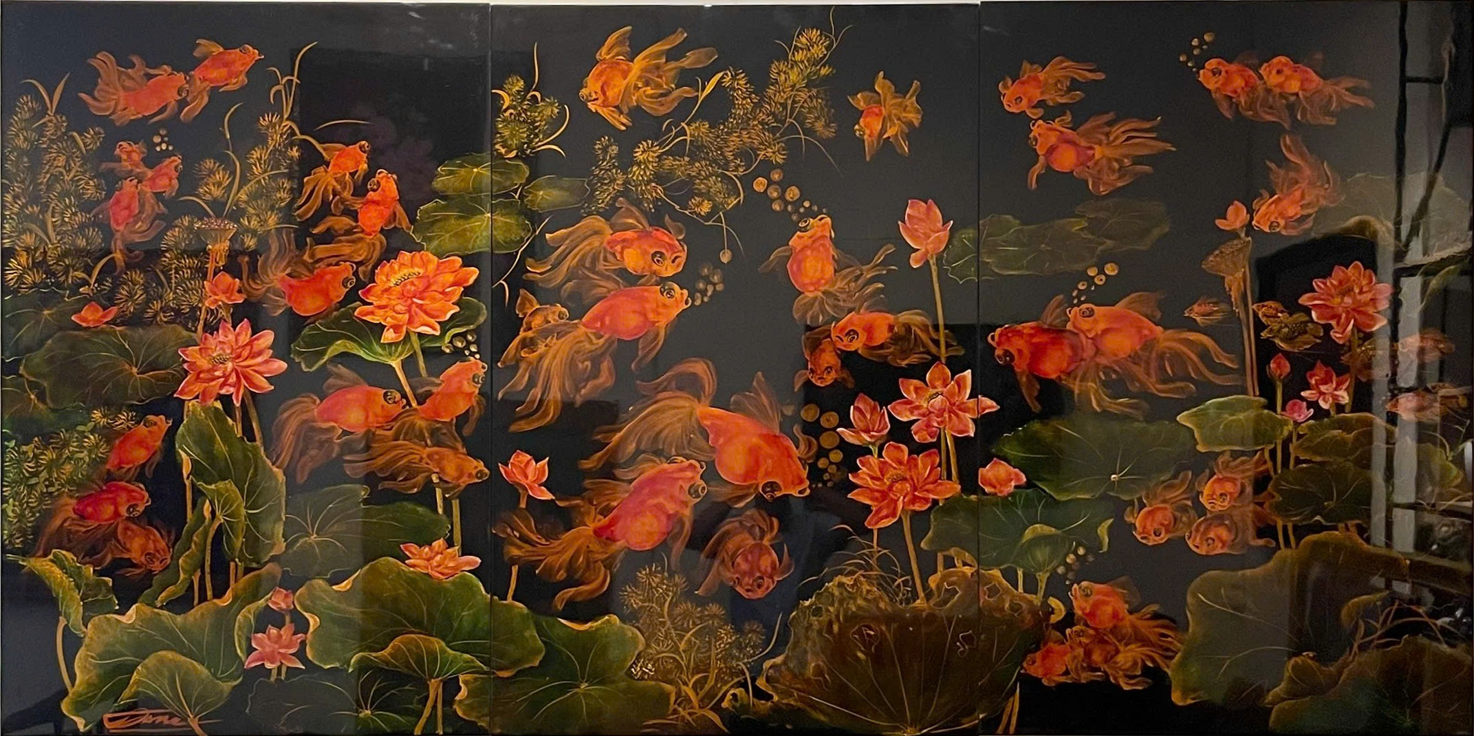 Phú quý liên ngư — Lotus flowers and fish fill a broad, dark-ground composition. Orange blossoms, sweeping foliage and flowing fins build a dense, decorative aquatic world.