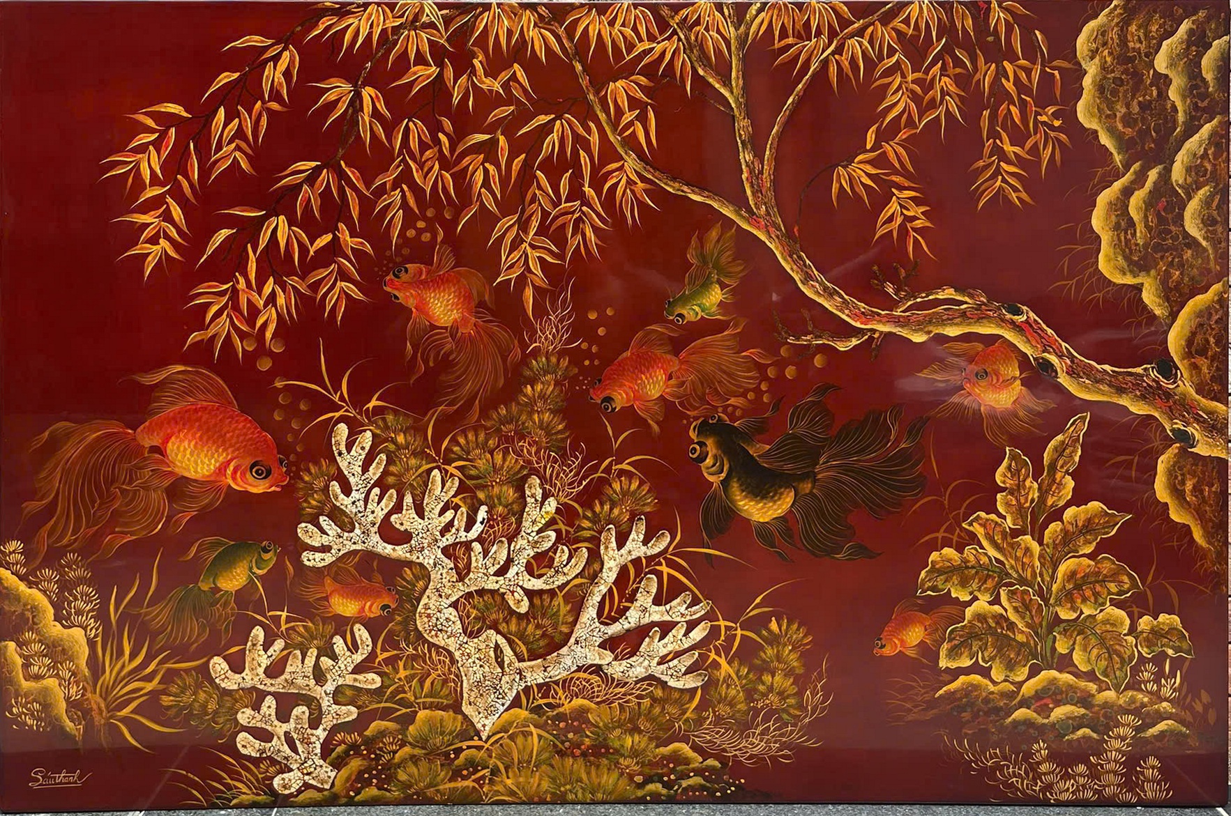 Ngư tảo — Fish and aquatic foliage spread across a red ground. Fine gold-toned stems and flowing tails give this horizontal composition its lively movement.